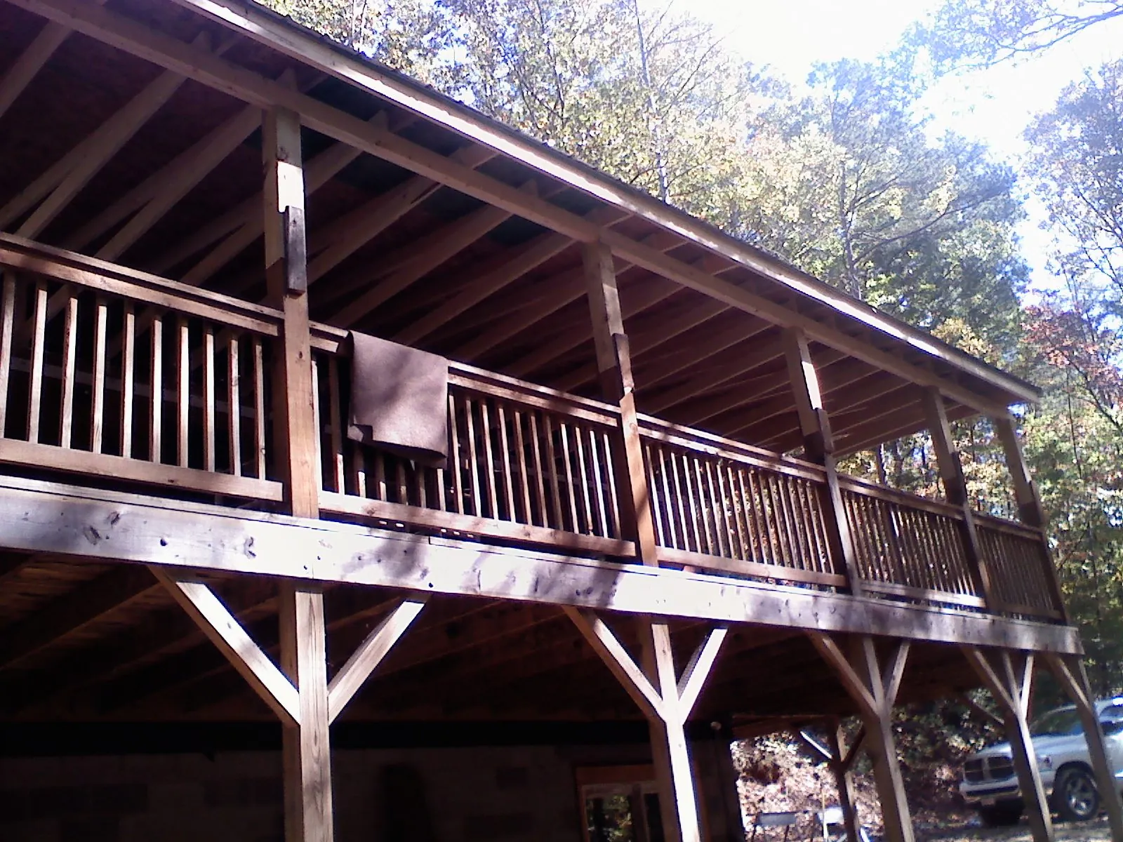 Timber framing under a new elevated porch and deck — Roof Leak Repair in Sanbornton by Roofing Brothers